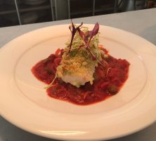 basil & parmesan crusted haddock fillet on a tomato ragout