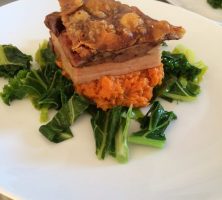 Pork belly with wilted greens, sweet potato mash with a white wine & thyme jus