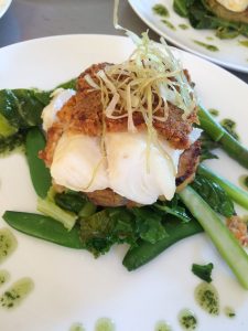 Cod topped with a basil, parmesan & chorizo crust on crushed new potatoes & summer greens
